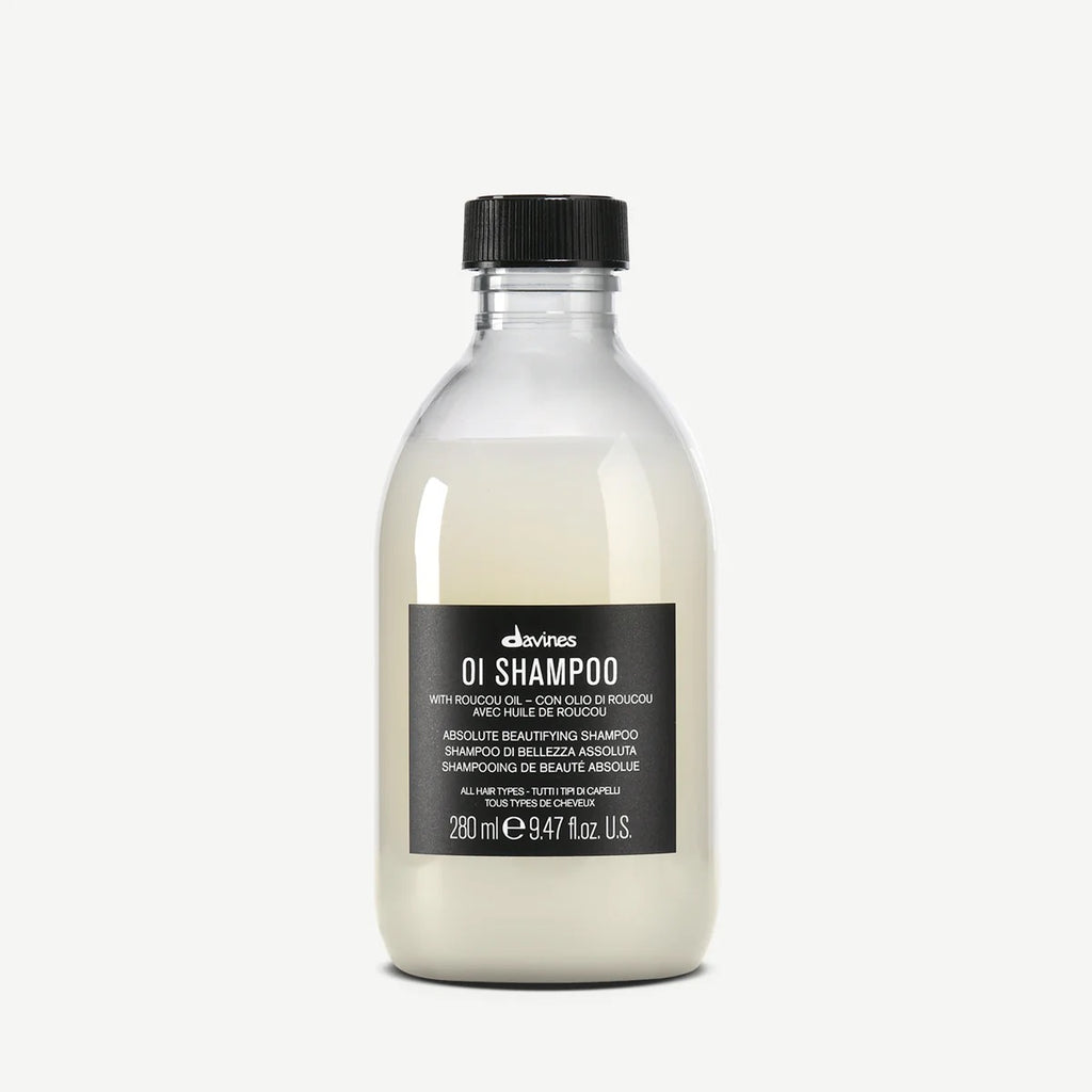 Bottle of Davines OI Shampoo on a white background