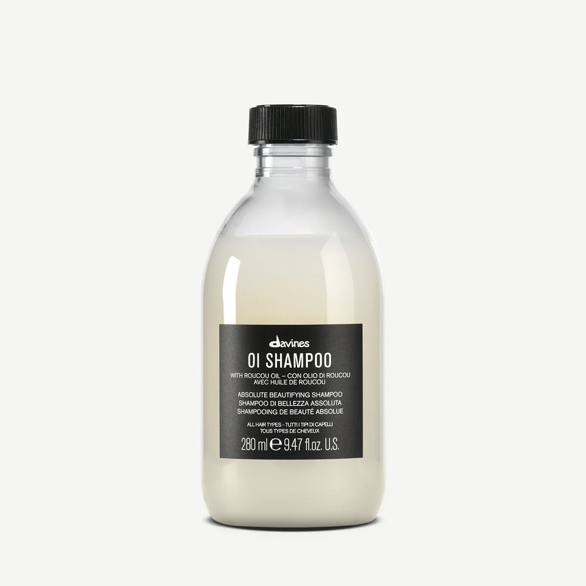 Bottle of Davines OI Shampoo on a white background